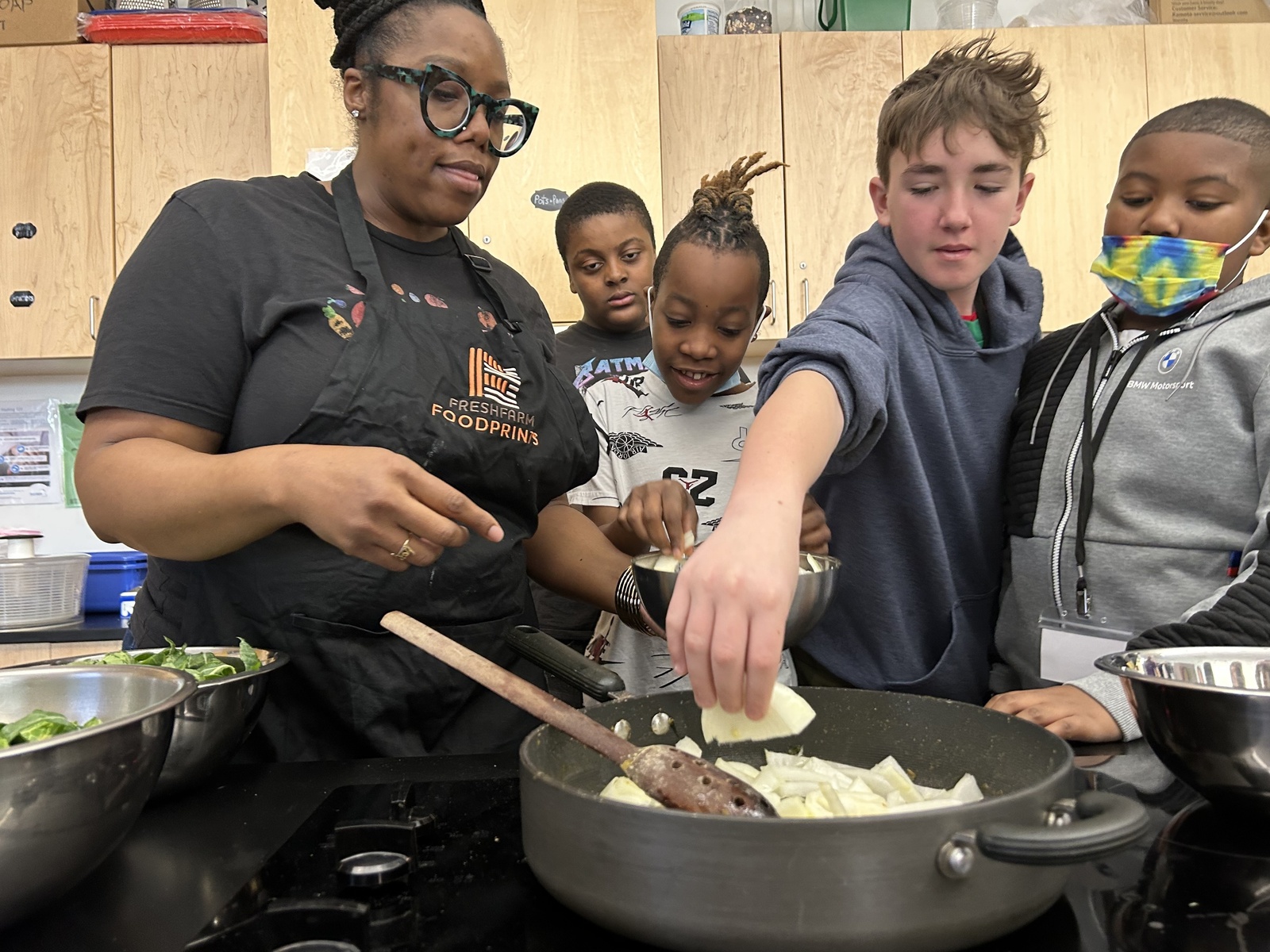 Teens learning about cooking and nutrition together